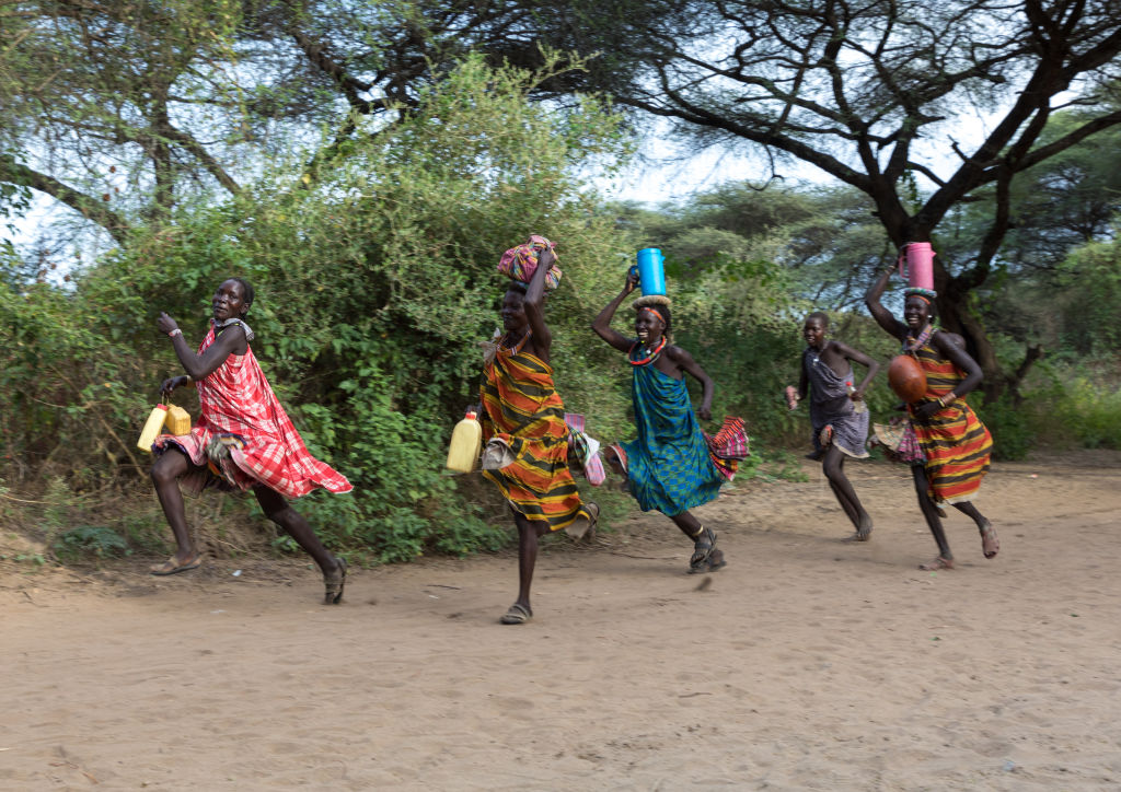 Toposa tribe women running
