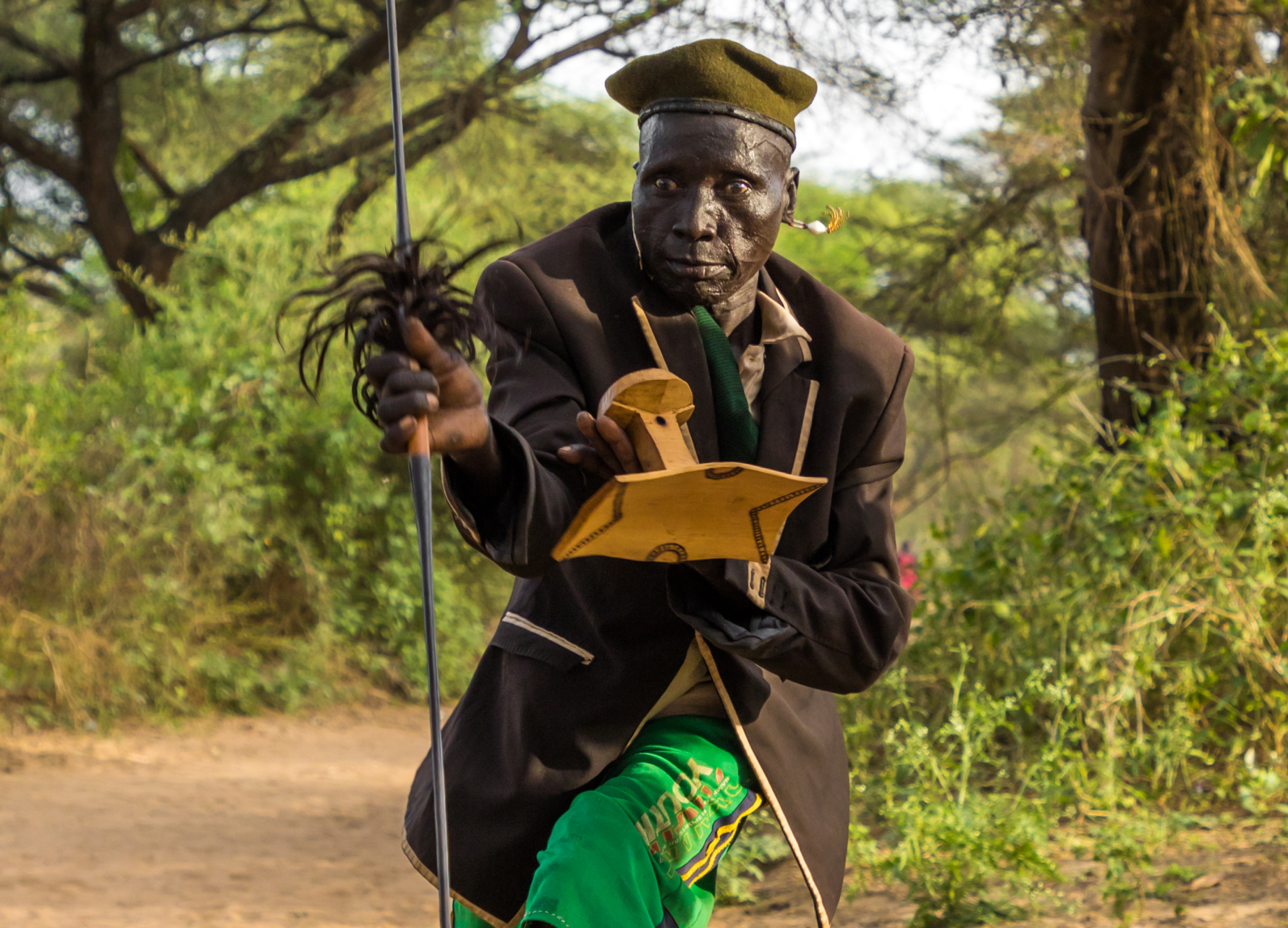 Toposa tribe man dancing with a spear
