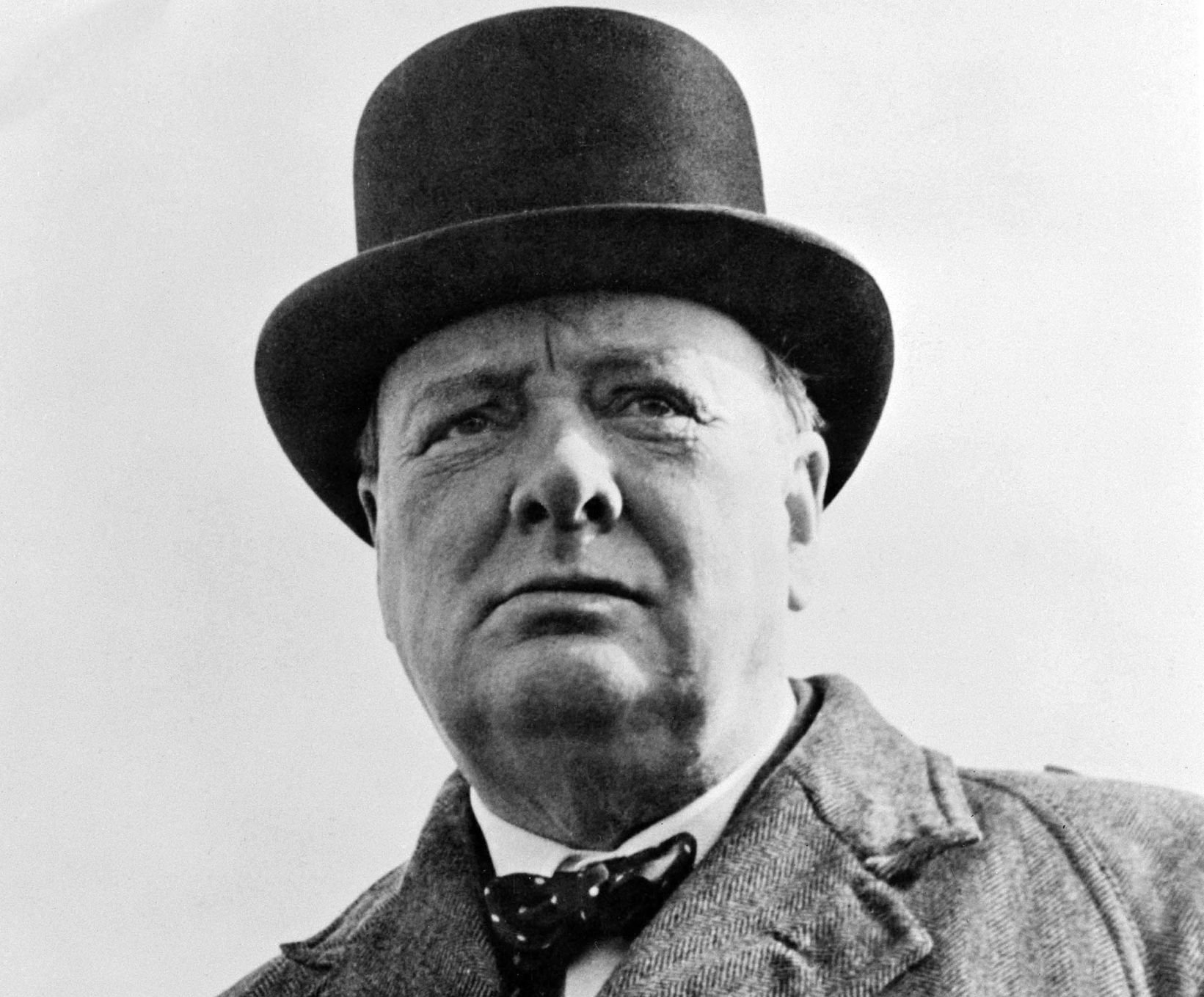 Grayscale Portrait Photo of Sir Winston S Churchill in a gray outfit