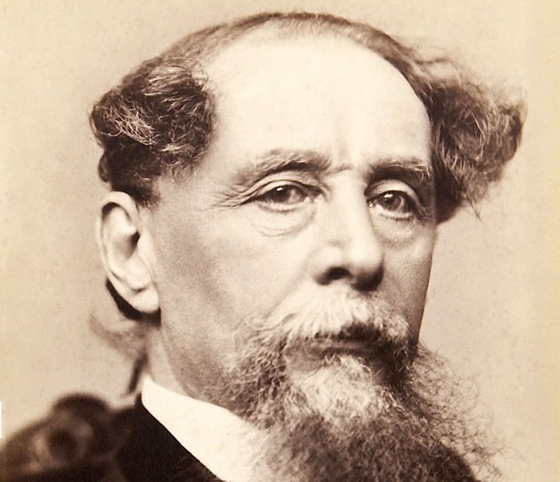 Grayscale Portrait Photo of Charles Dickens in a dark outfit