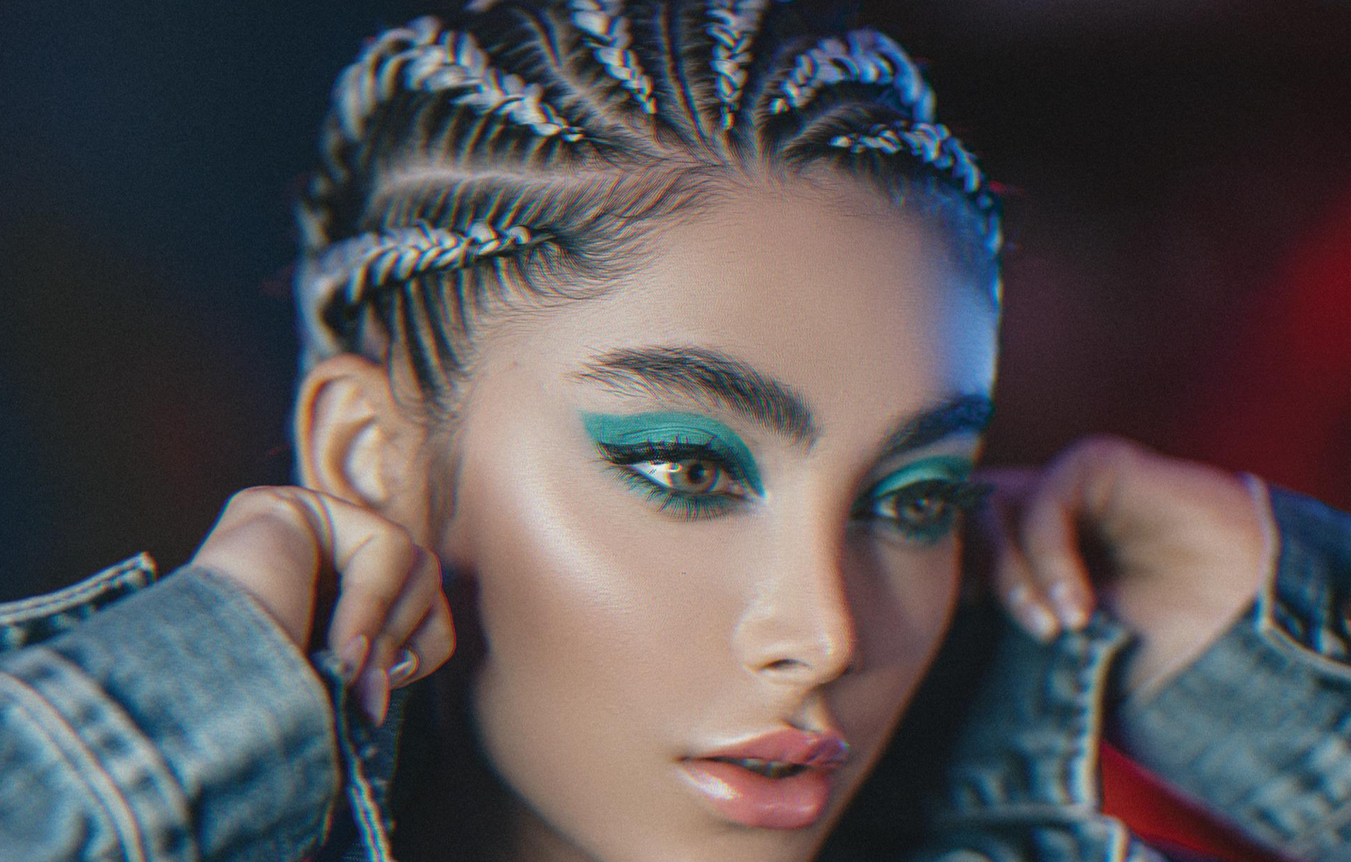 Beautiful woman with makeup and cornrows