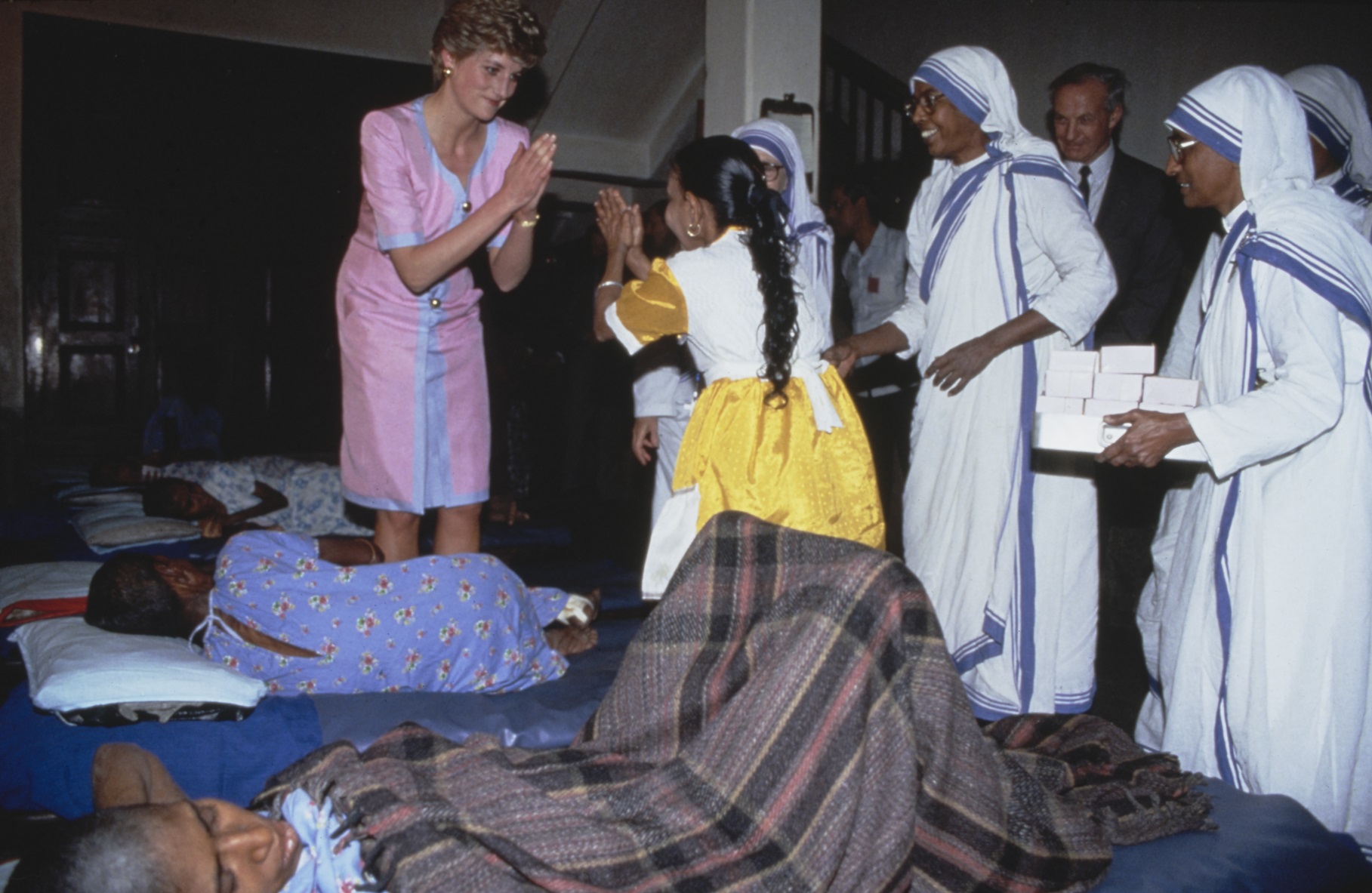 Diana, Princess of Wales greets people with the namaste during a visit the Kalighat Home for the Dying, run by Mother Teresa's Missionaries of Charity, in Kolkata, India, 15th February 1992.