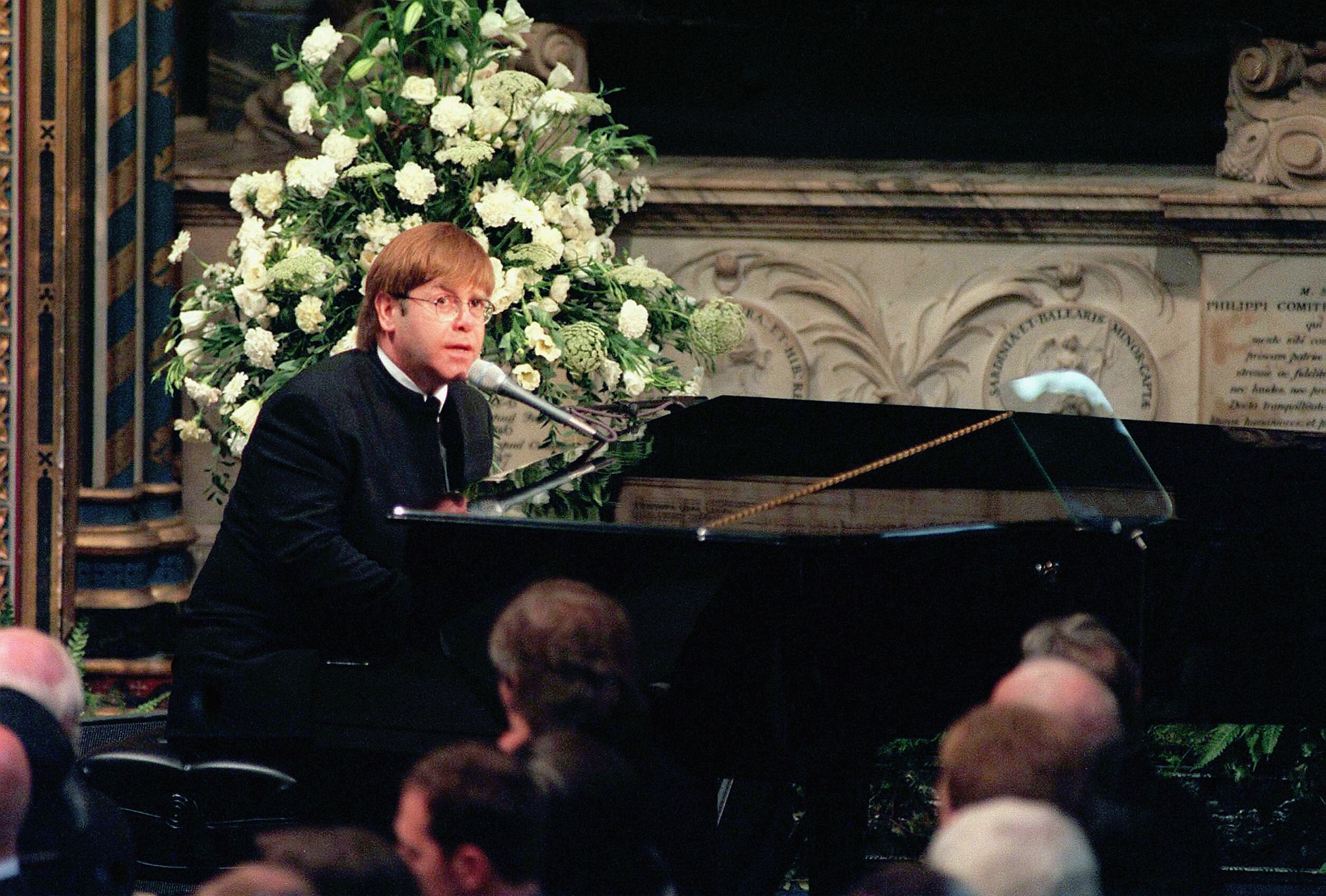 Sir Elton John sings 'Candle in the Wind' at the funeral if Diana, Princess of Wales at Westminster Abbey on September 6, 1997 in London
