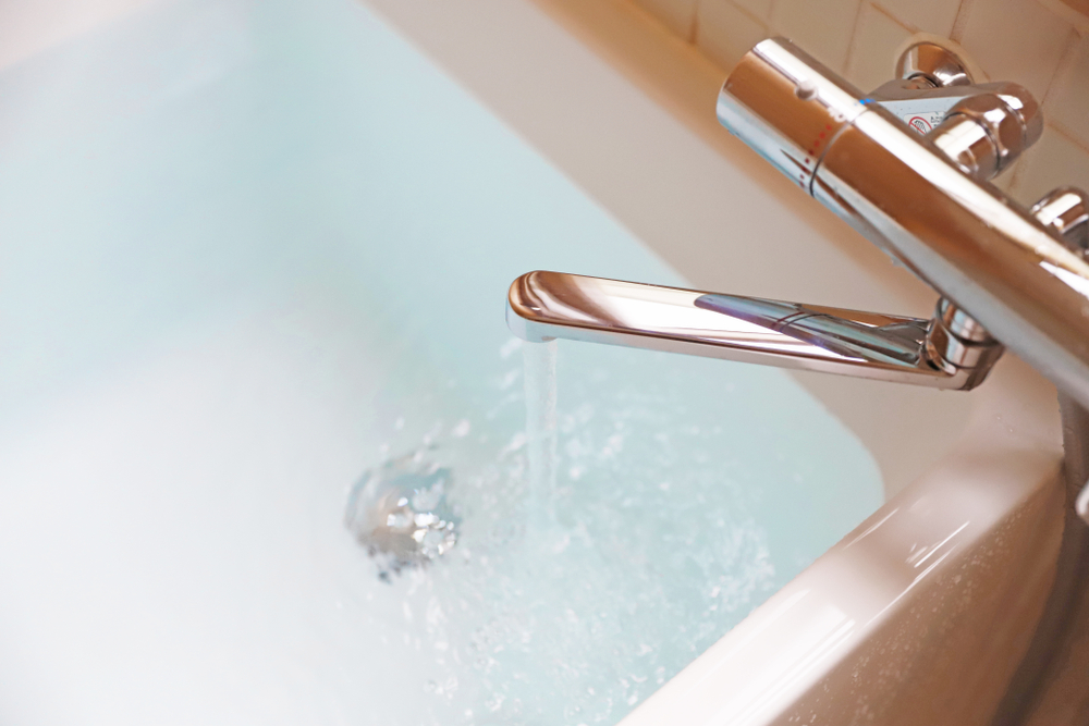 A clean bathtub with hot water