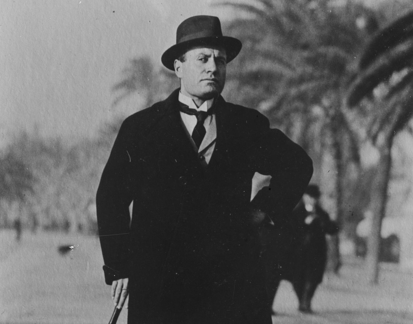 Grayscale Portrait Photo of Benito Mussolini in a dark outfit