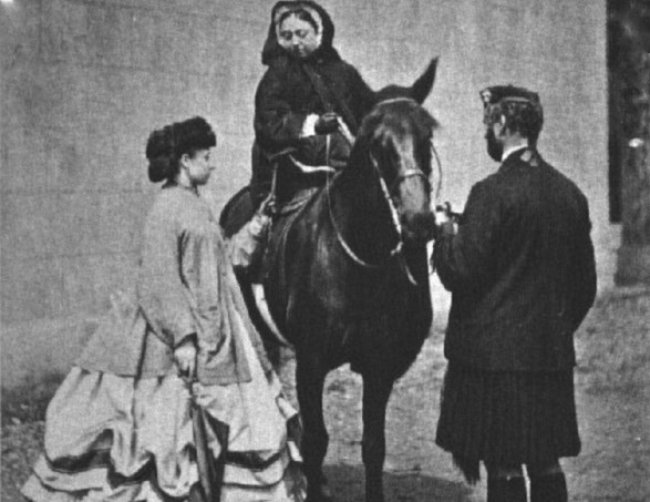 Queen Victoria, Princess Louise and John Brown, photographed on a horse