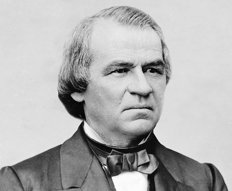 Grayscale Portrait Photo of U.S. President Andrew Johnson in a dark suit