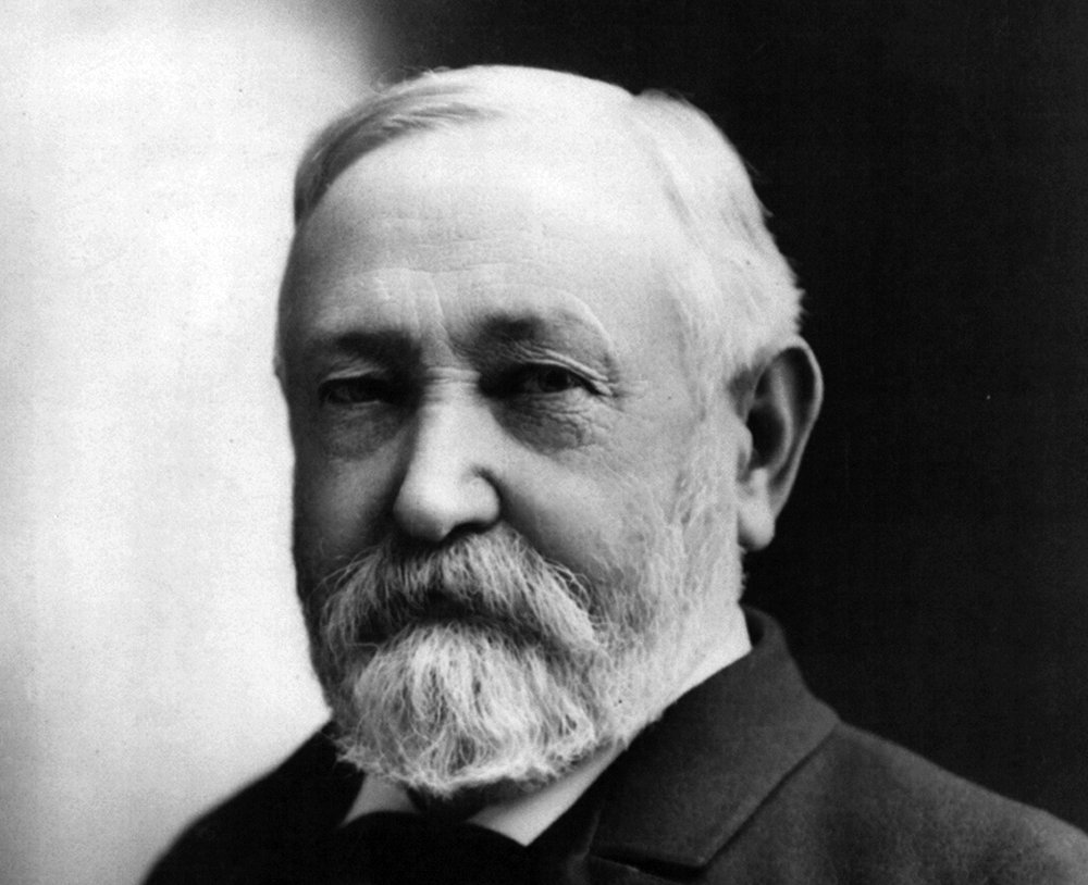 Grayscale Portrait Photo of U.S. President Benjamin Harrison in a dark suit