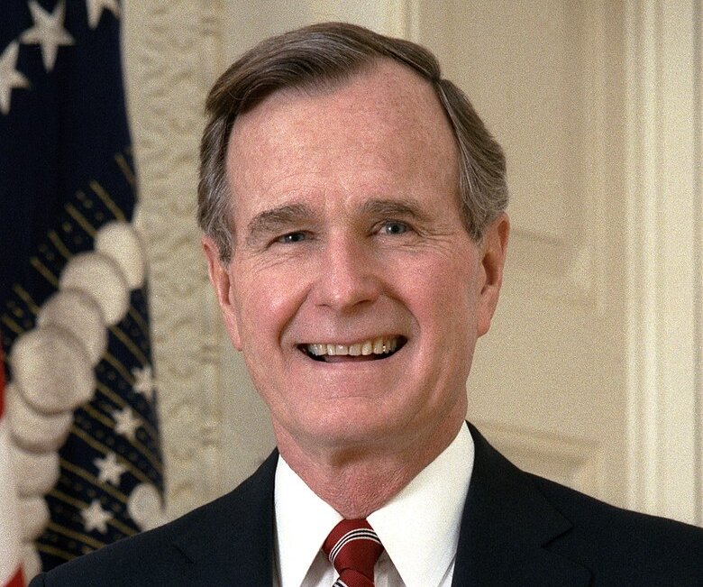 Portrait Photo of U.S. President George H. W. Bush in a dark blue suit