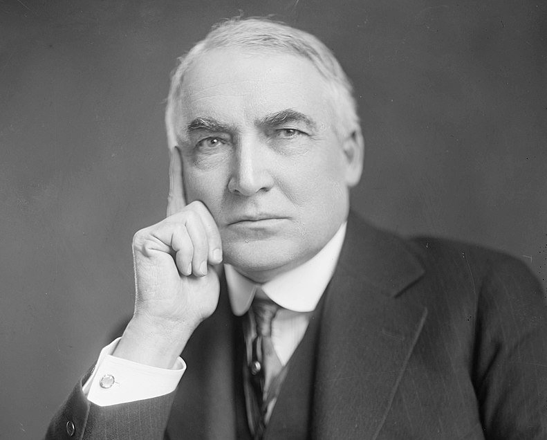 Grayscale Portrait Photo of U.S. President Warren G Harding in a dark suit