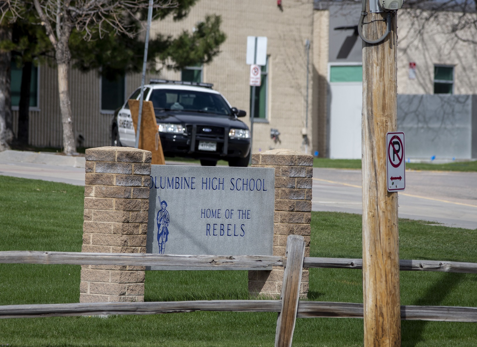 Police patrol outside a locked Columbine High School on April 17, 2019 in Littleton, Colorado