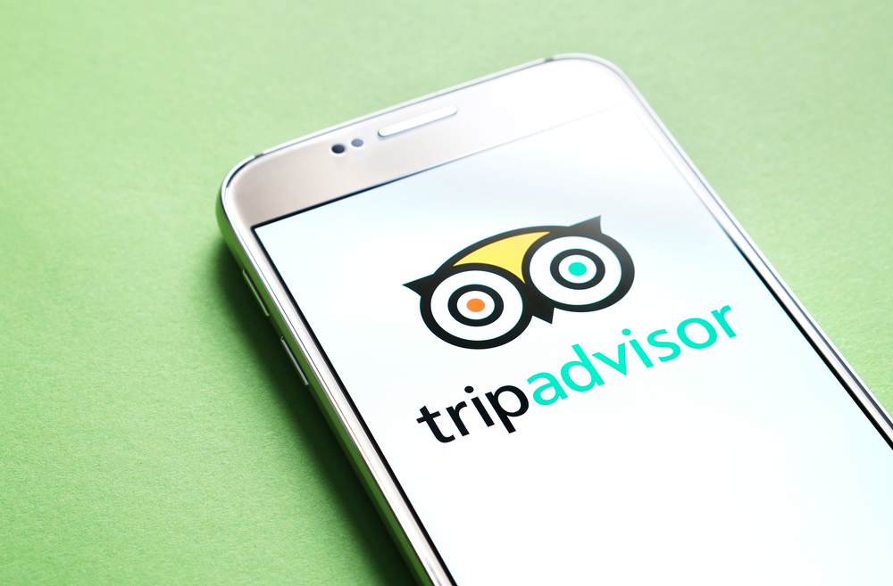 Tripadvisor logo on smartphone screen