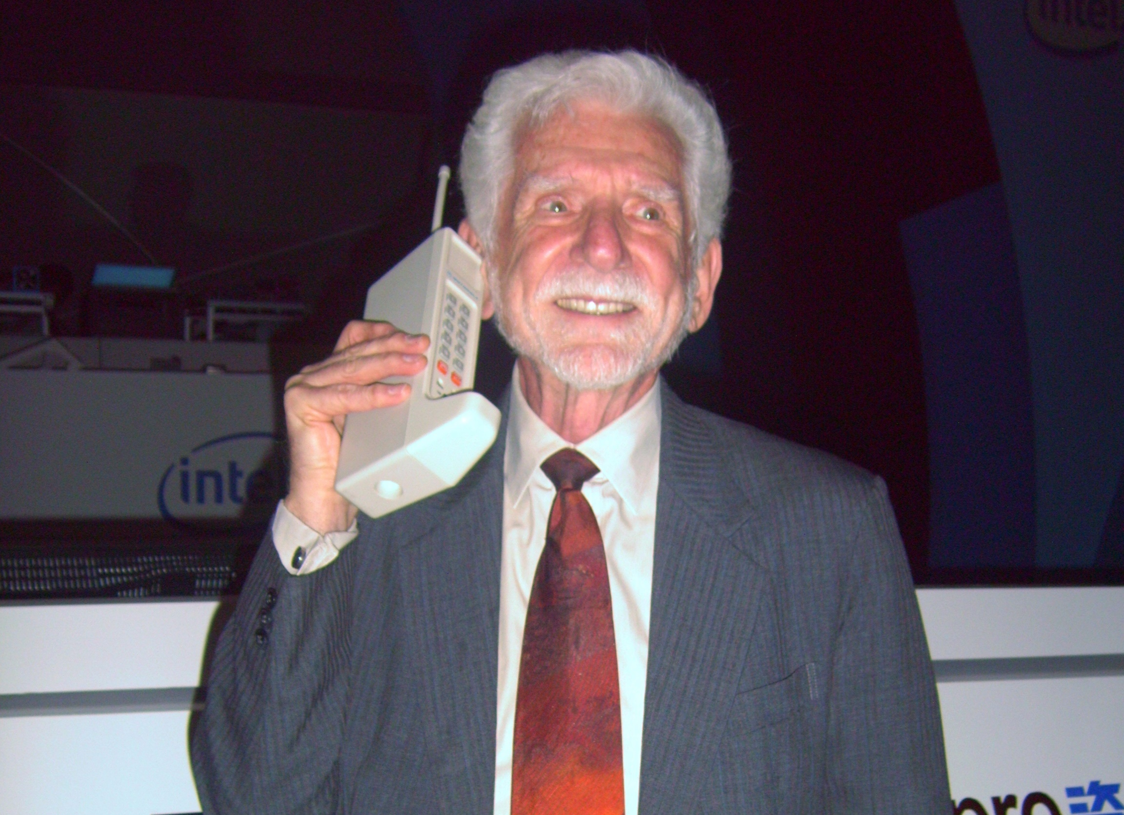 Martin Cooper of Motorola, shown here in a 2007 reenactment, made the first publicized handheld mobile phone call on a prototype DynaTAC model on 3 April 1973.