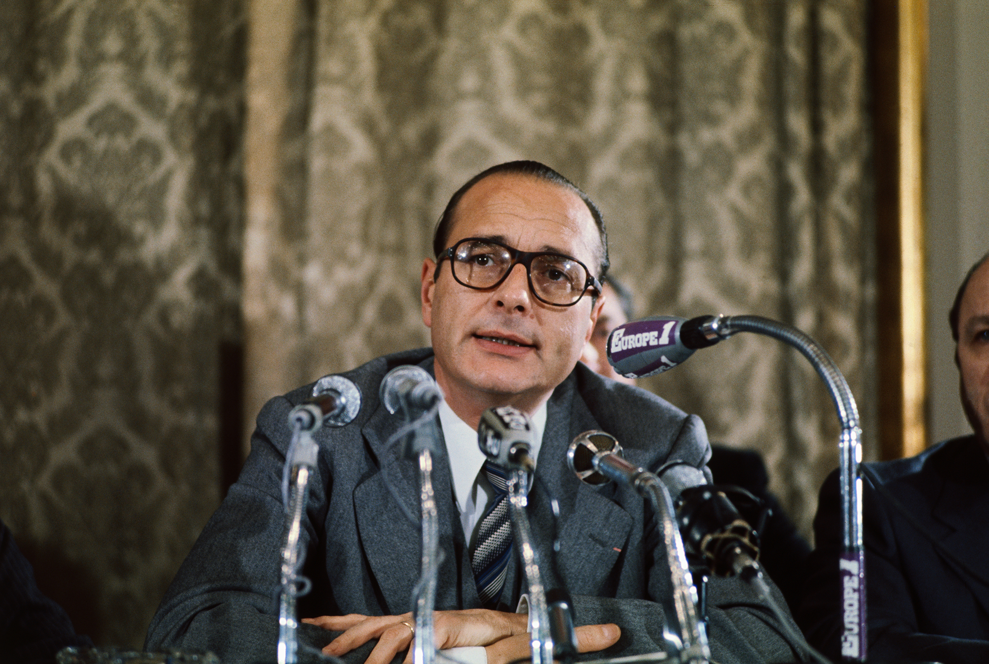 Jacques Chirac, former French Prime Minister is shown here in this closeup at a news conference.