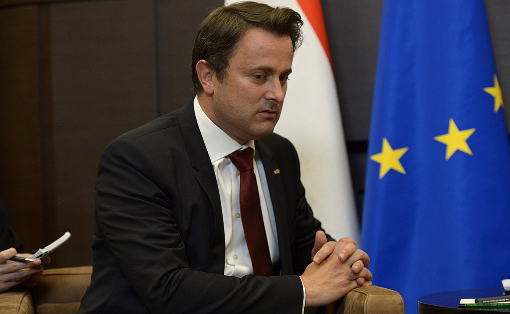 Portrait Photo of Xavier Bettel in dark suit leaning on chair