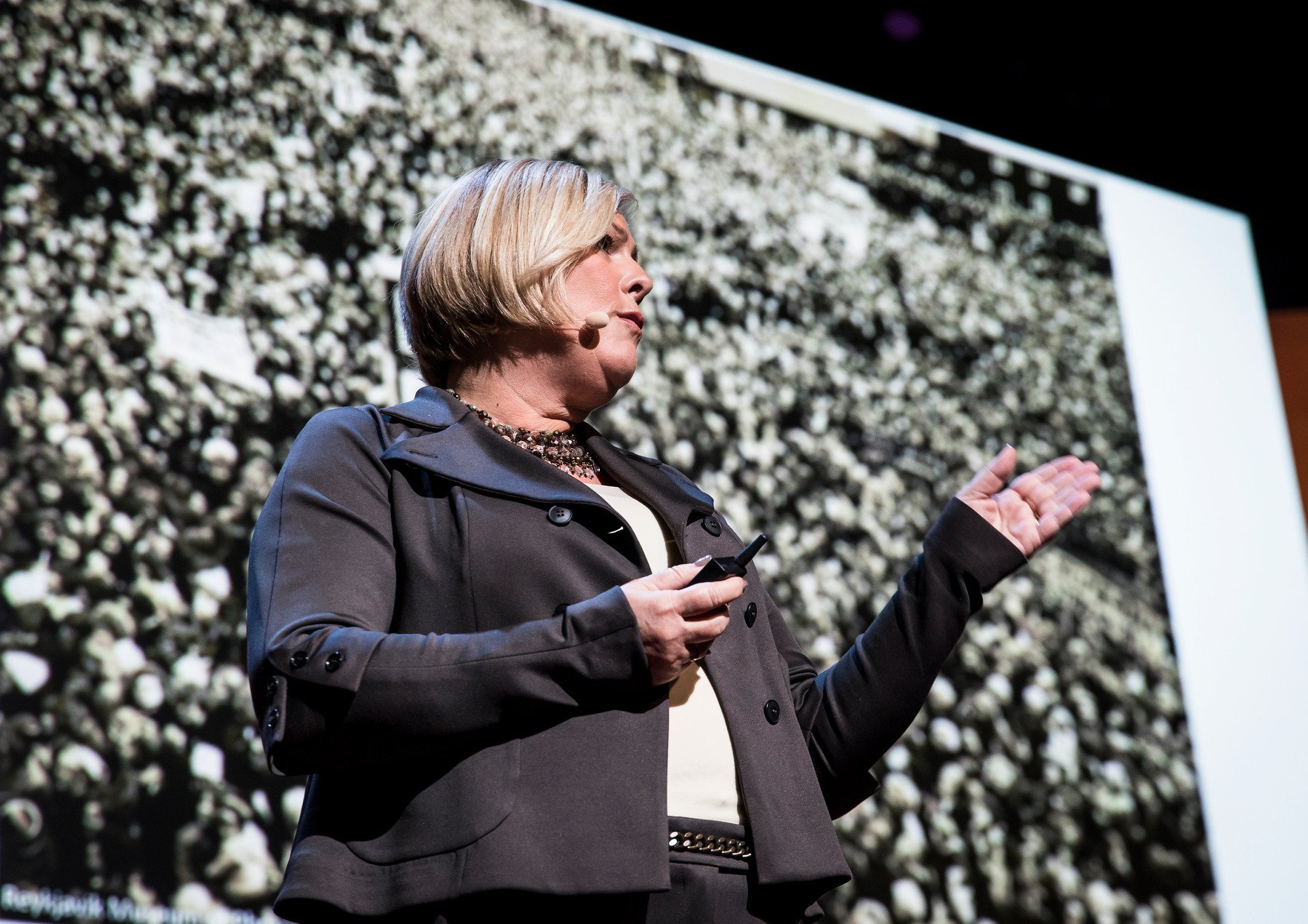 Portrait Photo of Halla Tómasdóttir speaking at TEDWomen 2016