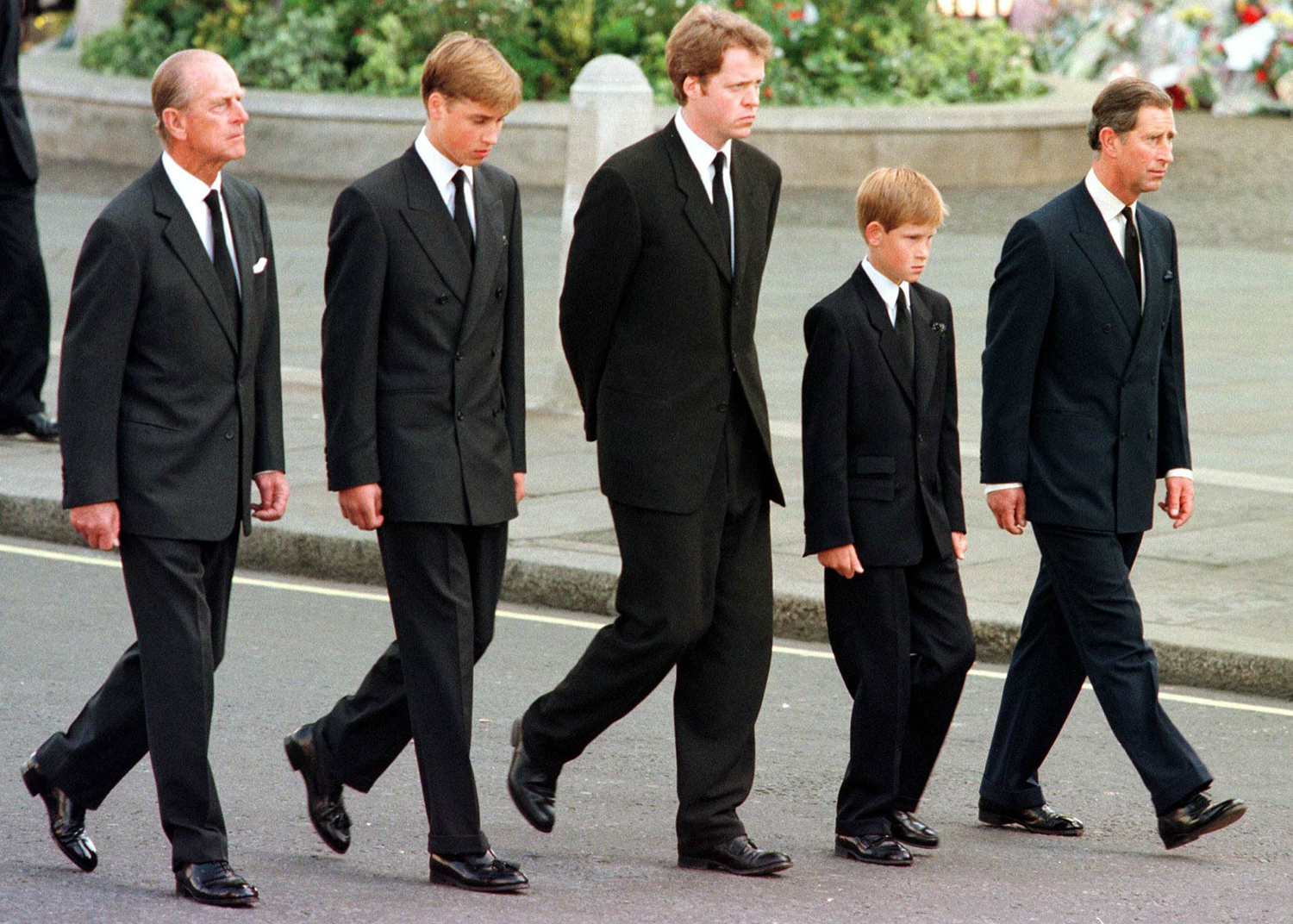 The Duke of Edinburgh, Prince William, Earl Spencer, Prince Harry and Prince Charles walk outside Westminster Abbey during the funeral service for Diana, Princess of Wales, 06 September.