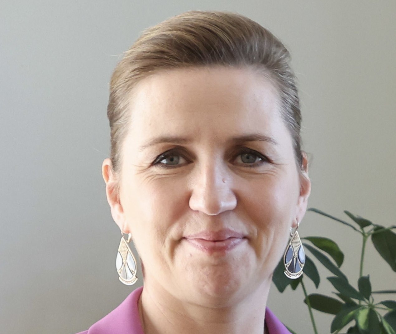 Portrait Photo of Mette Frederiksen in pink outfit
