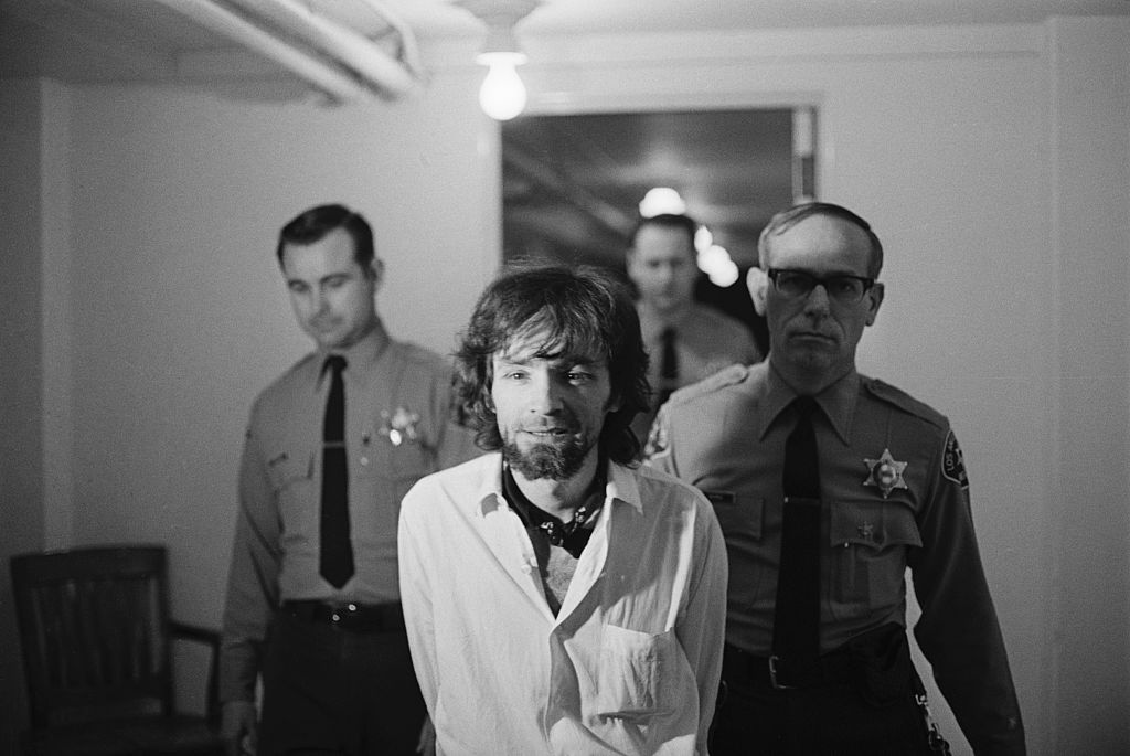 Charles Manson Being Escorted by Police
