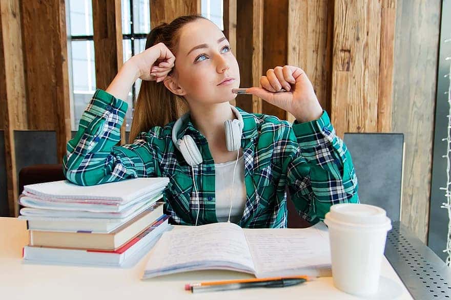 girl-young-student-sitting-table-books-notebook-pen-study