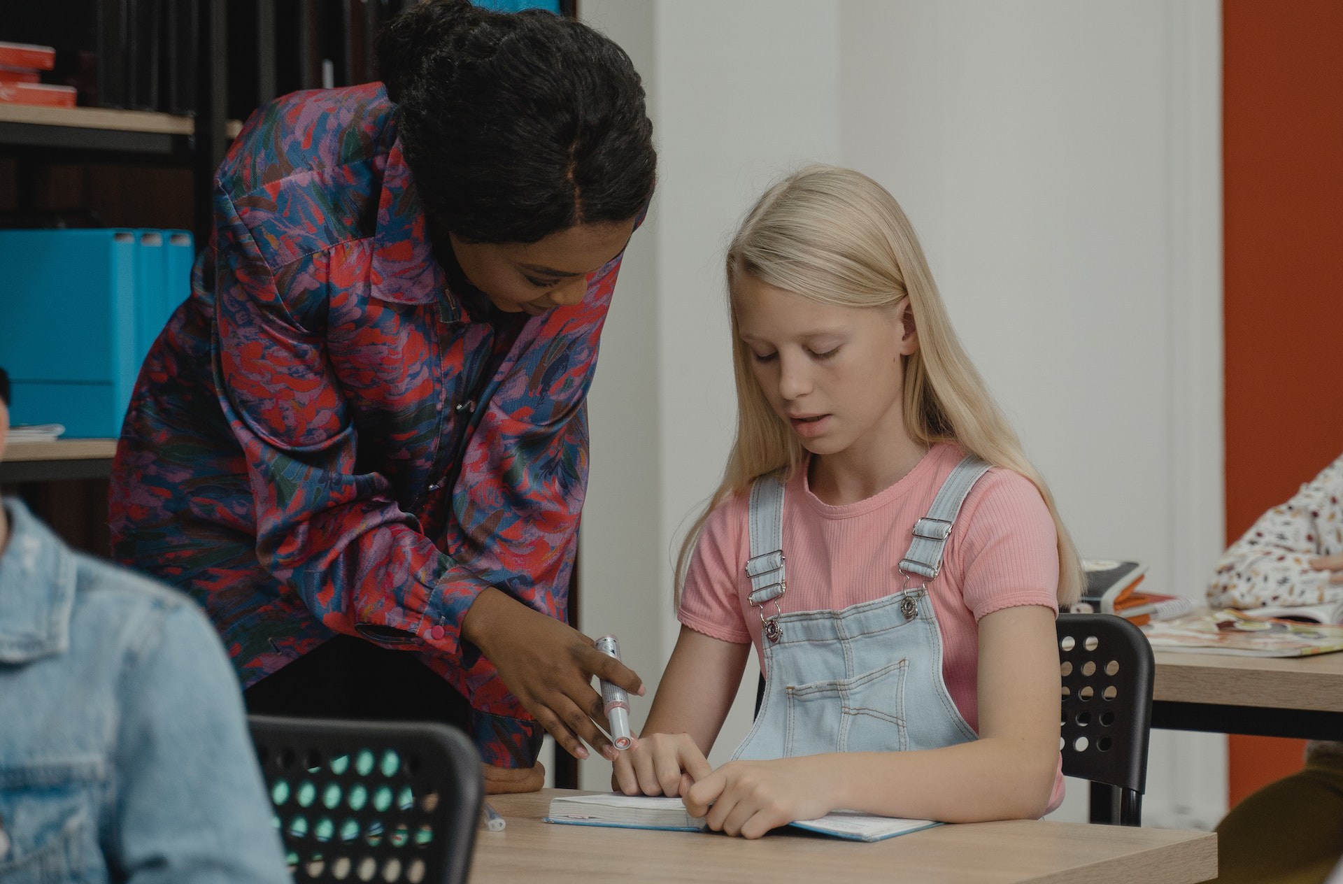Teacher helping student