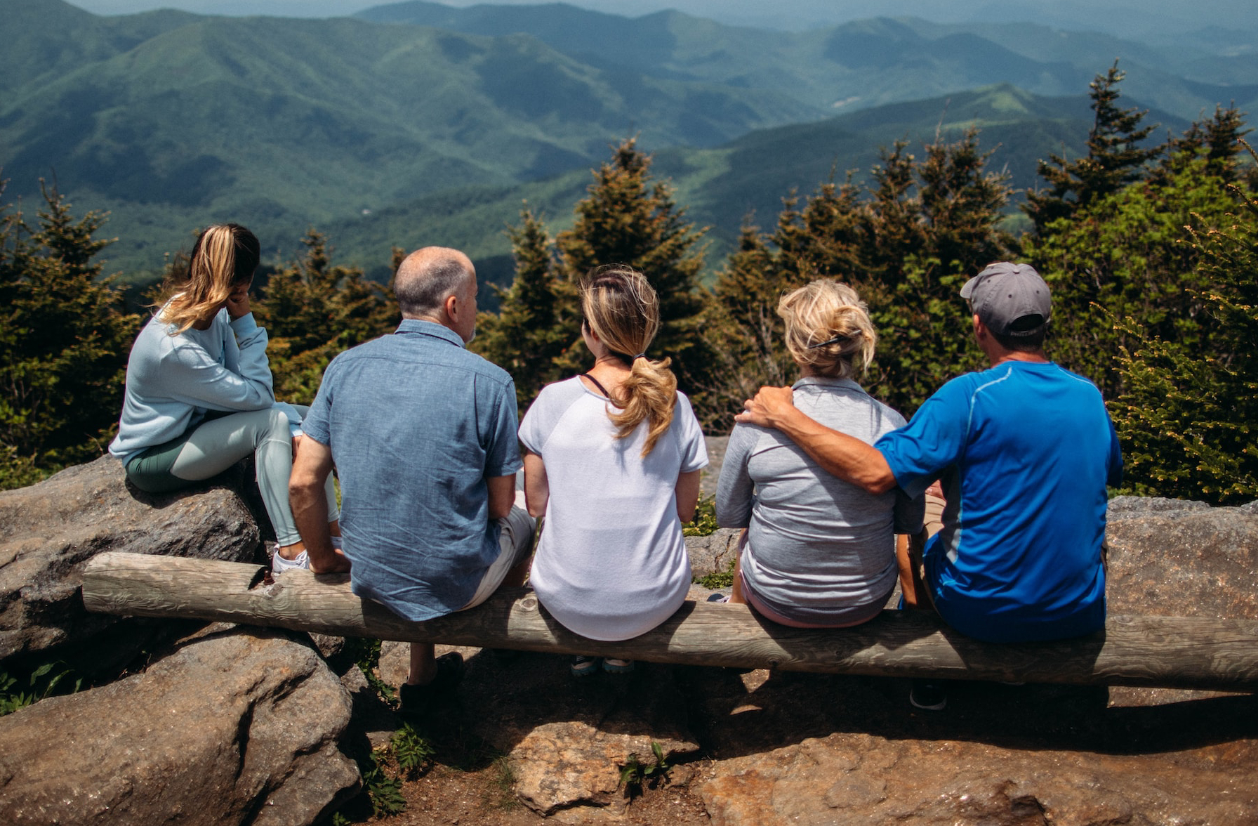 group  of people sitting on Rocks