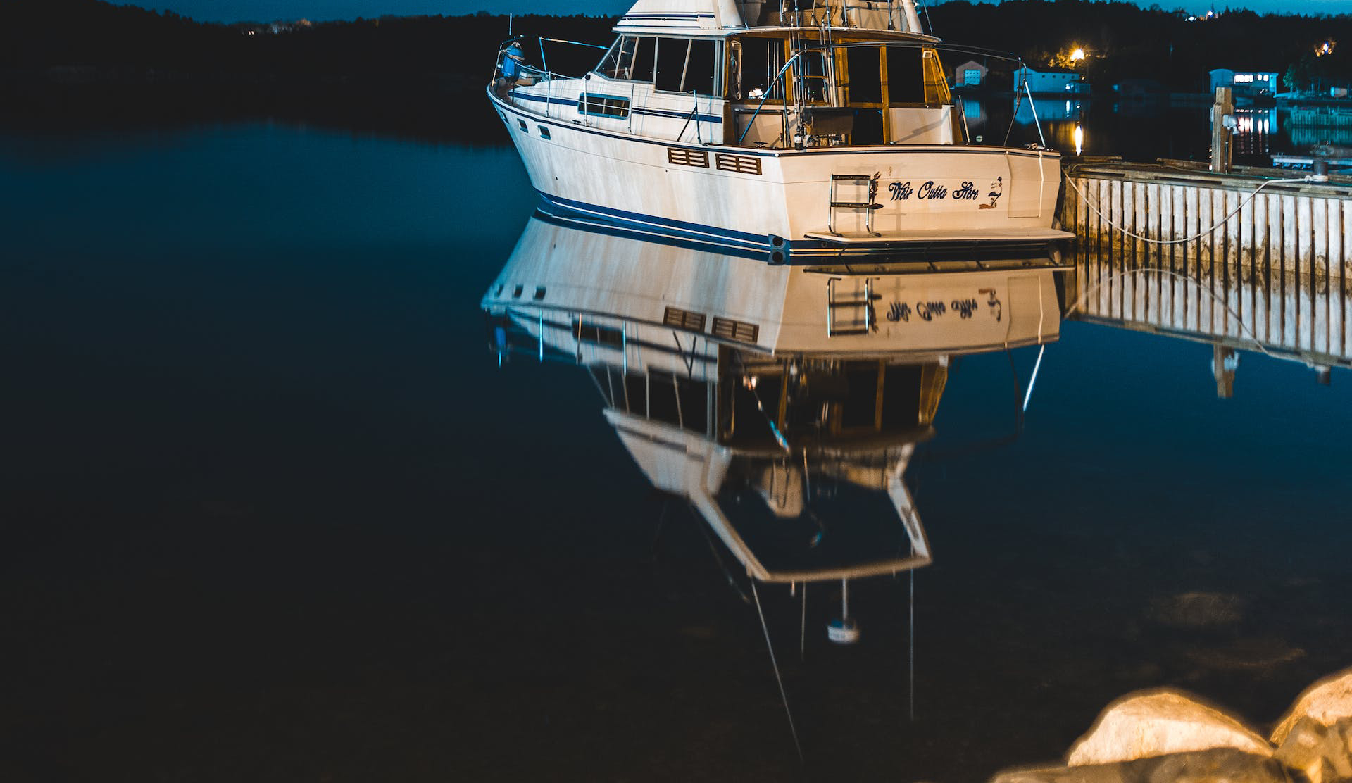 boat on dock during night