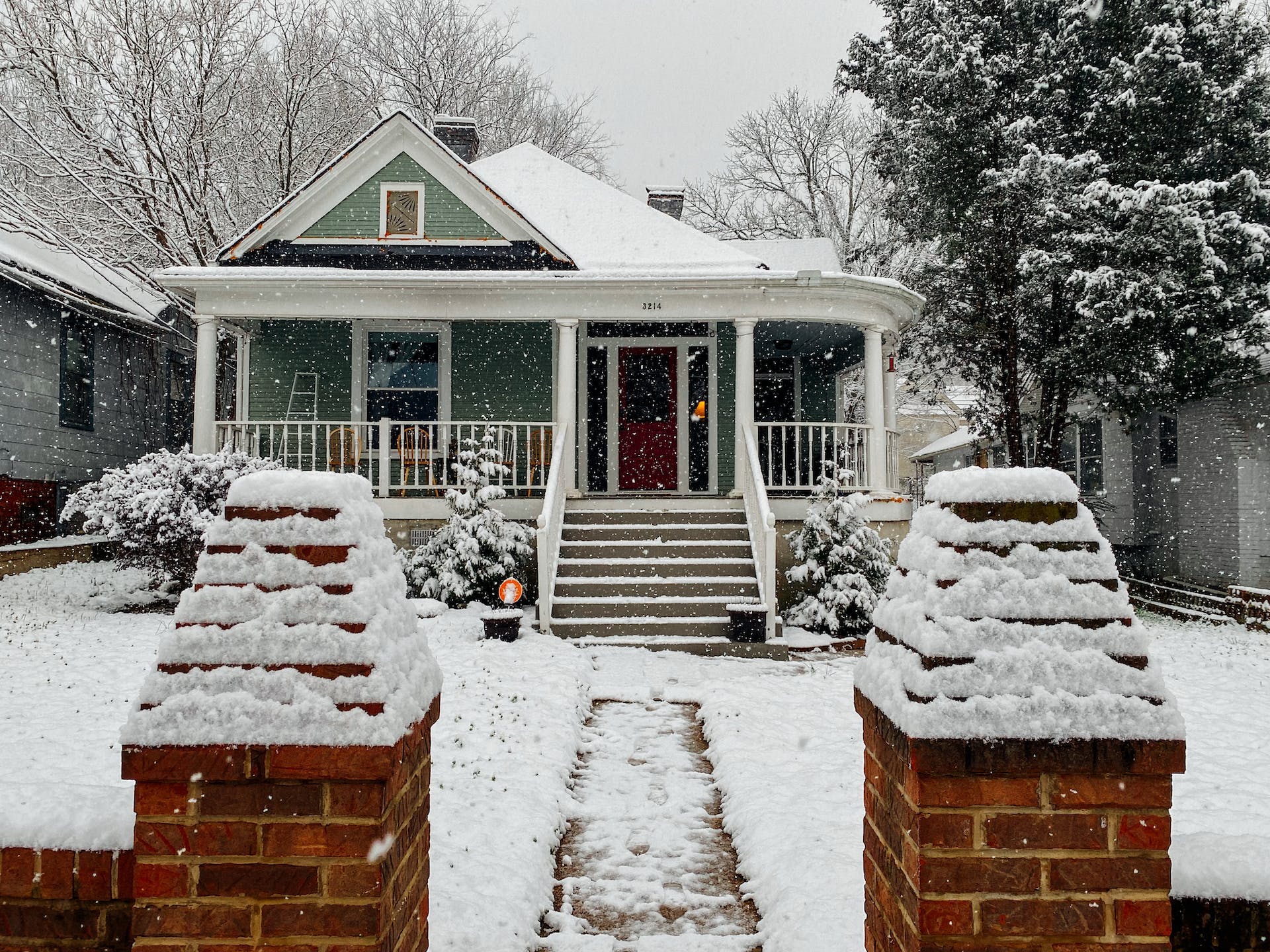snow covered wooden house