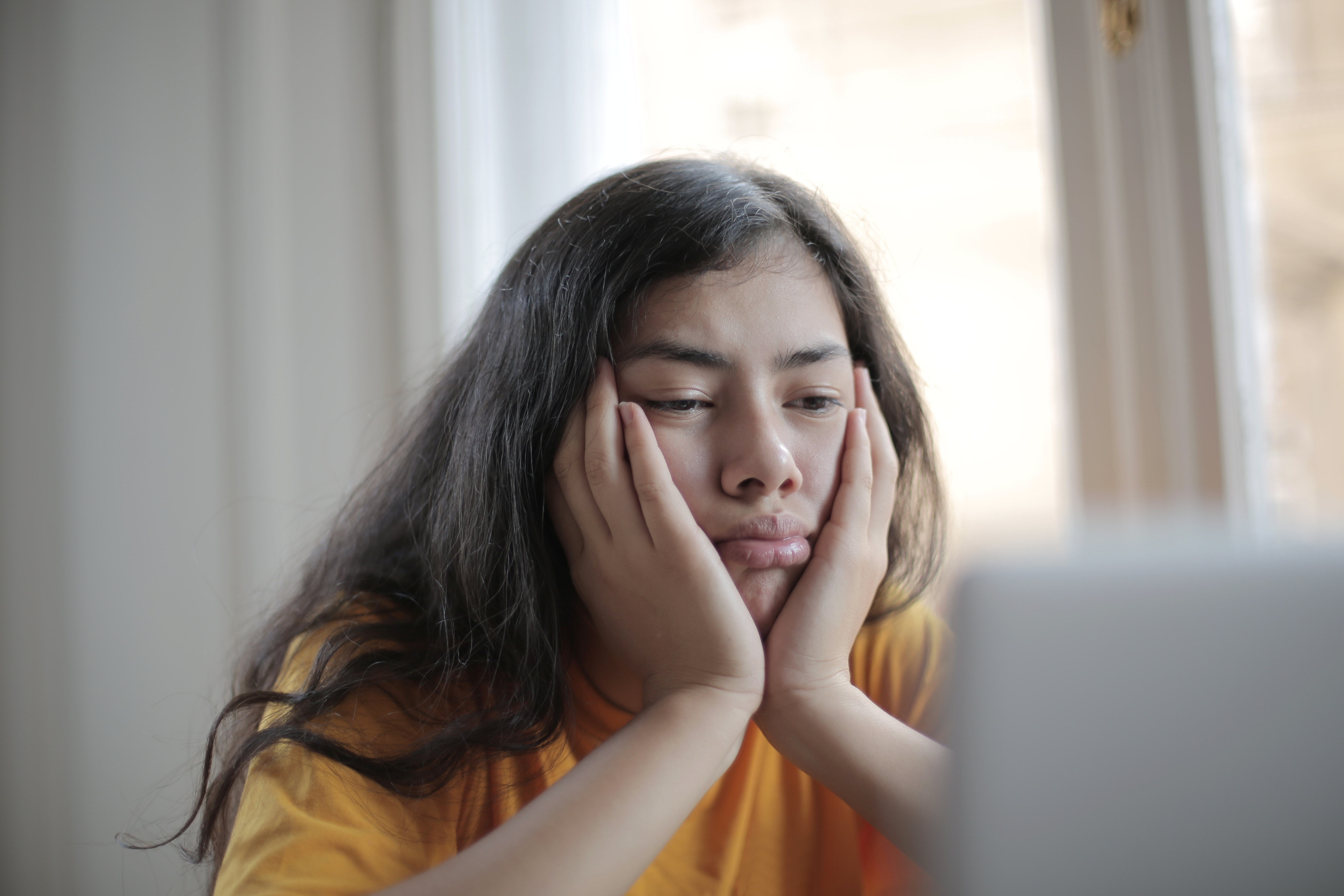 Tired person sitting in front of computer