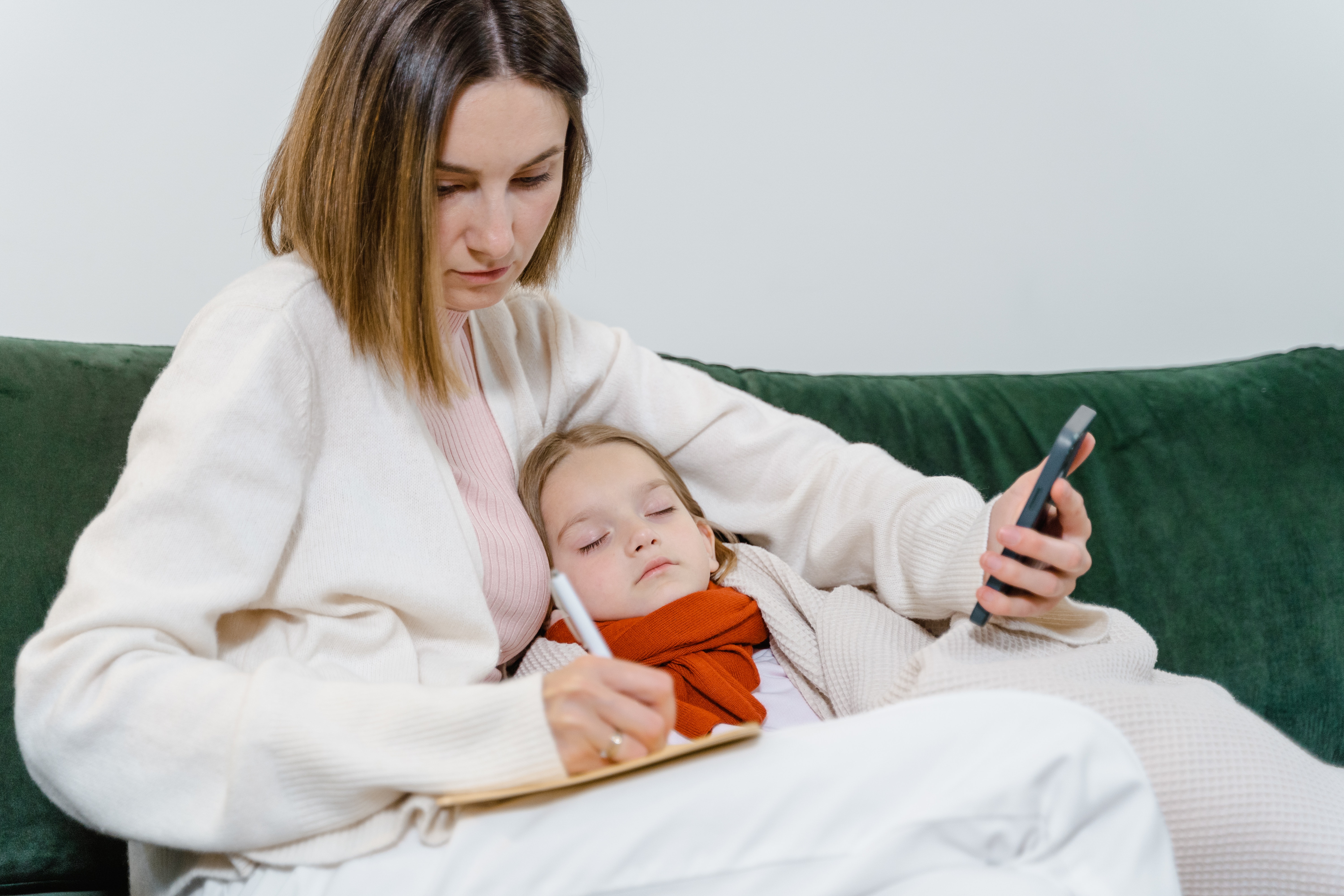 Mom with sick child using telemedicine