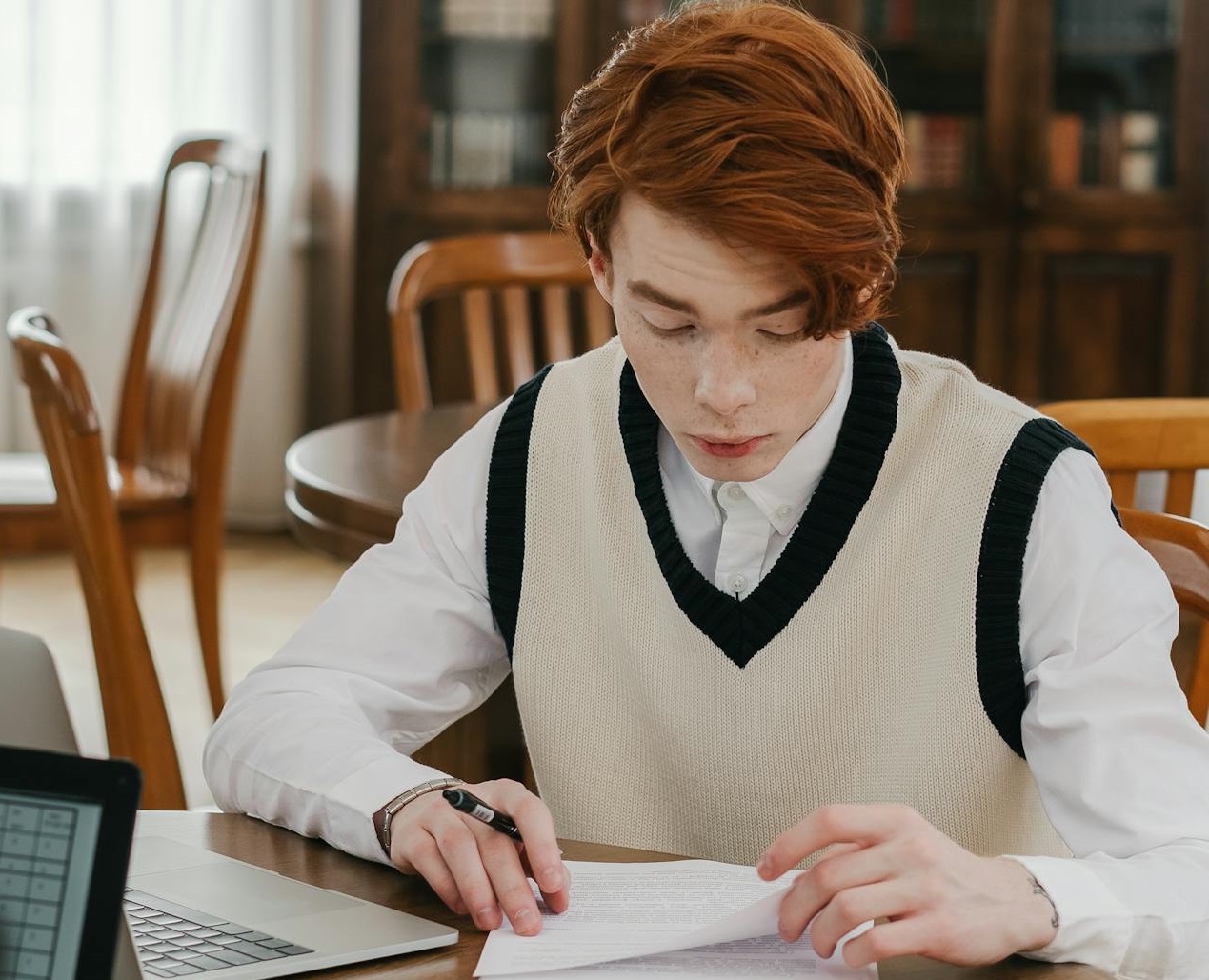 A Man Reading a Document