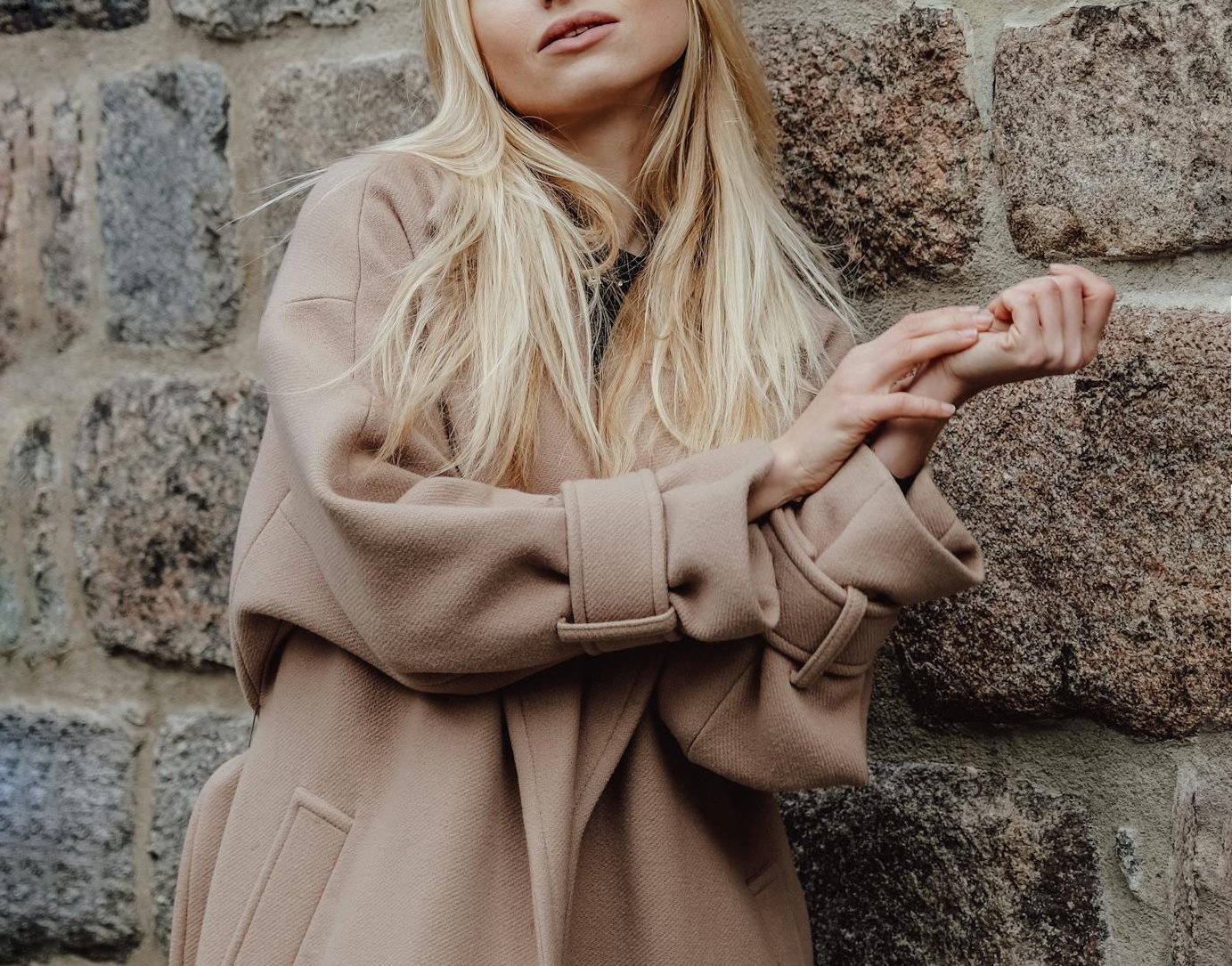 A woman in a beige coat