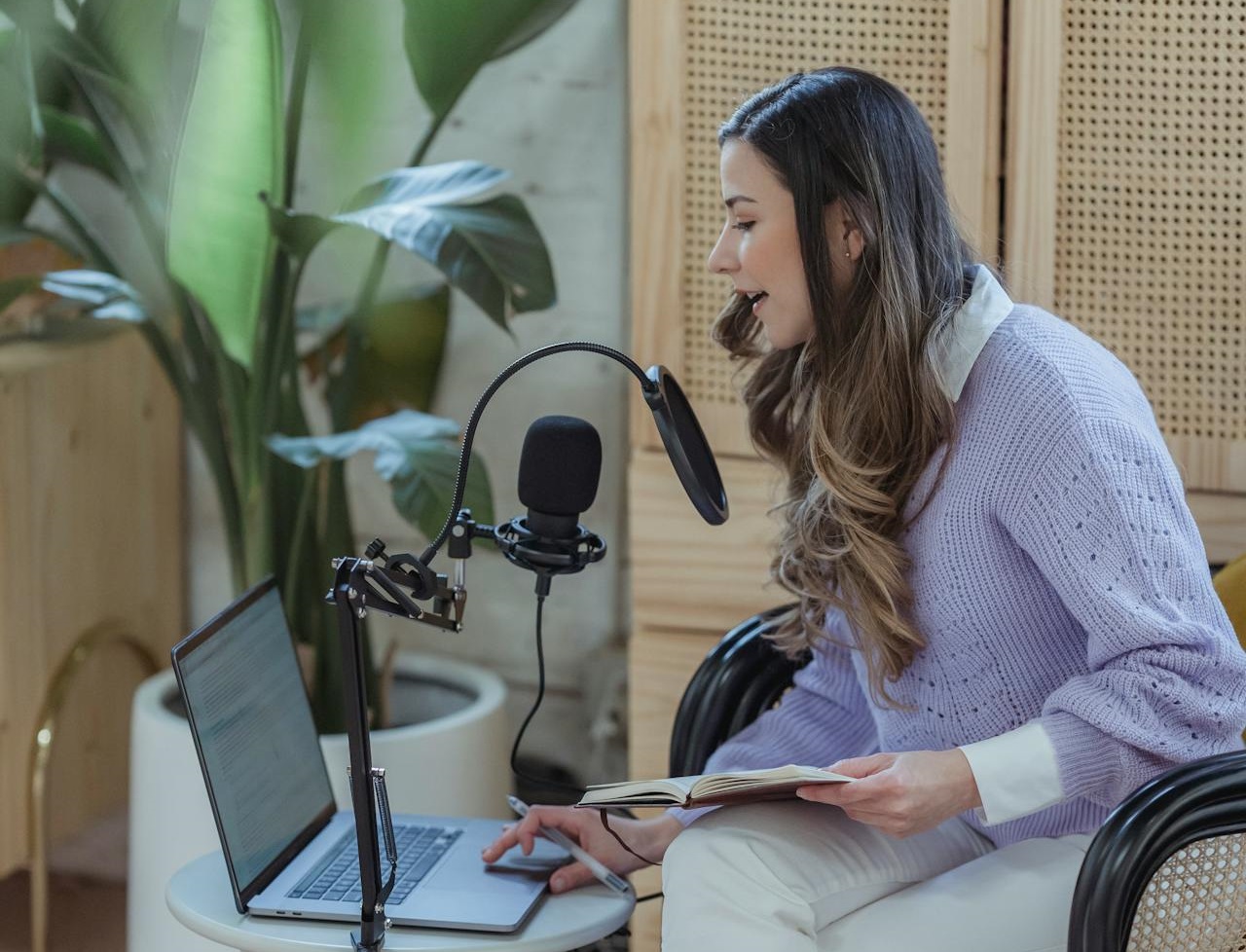 Female radio host broadcasting from home