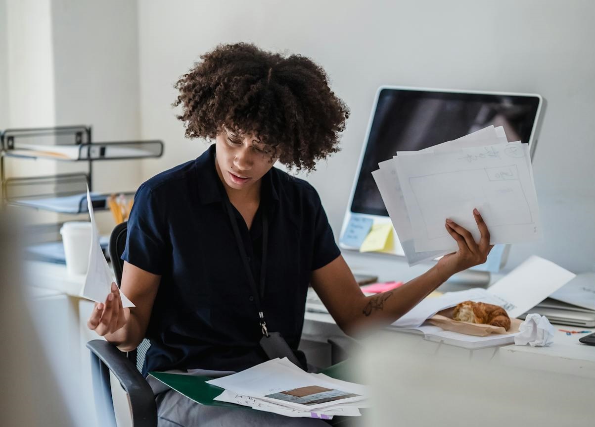 Woman Working With Documents in Office