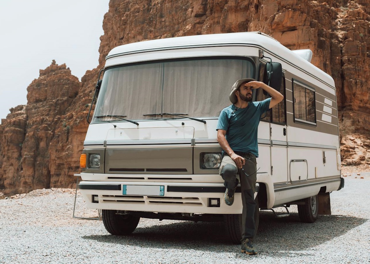 Man Posing by Camper