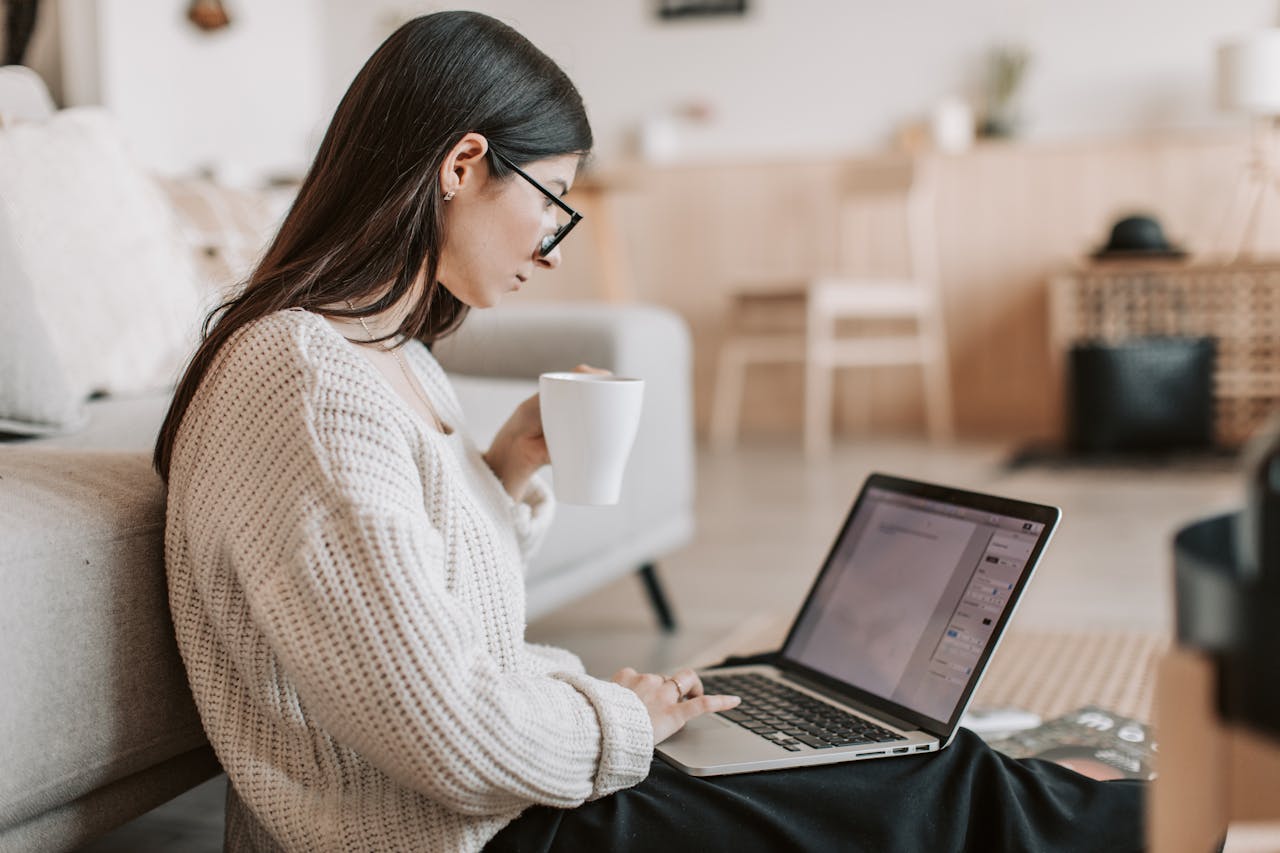 Woman working on laptop at home.
