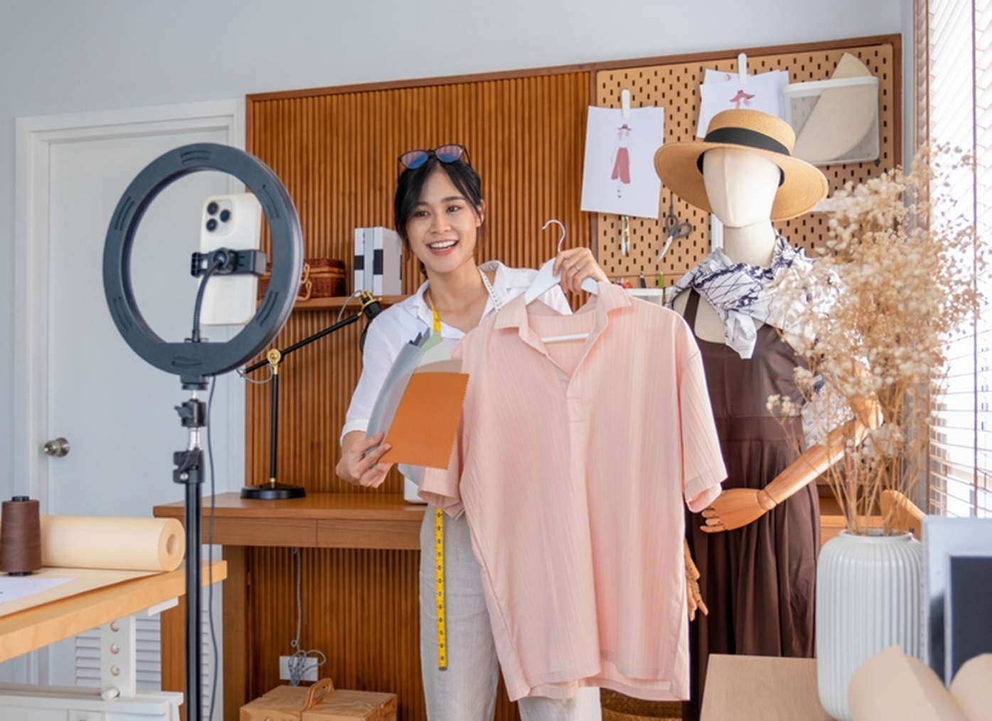 Young female designer make live streaming an engaging styling session to online customers