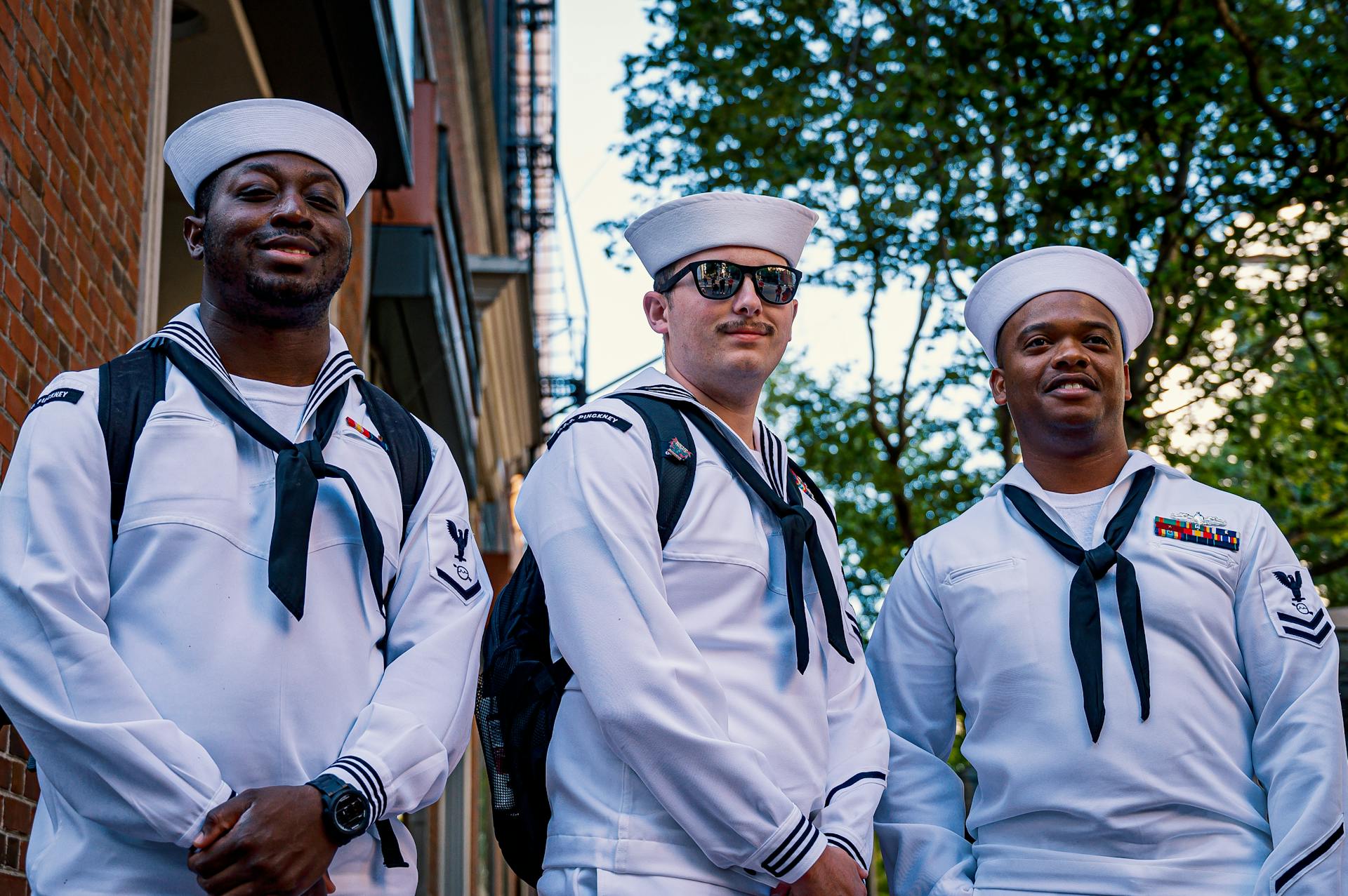 Three Sailors Standing in White Uniform and Smiling