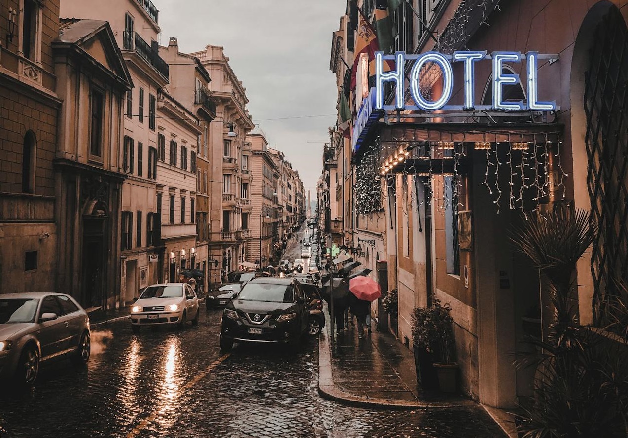 Photo of Vehicles on Road Near Buildings