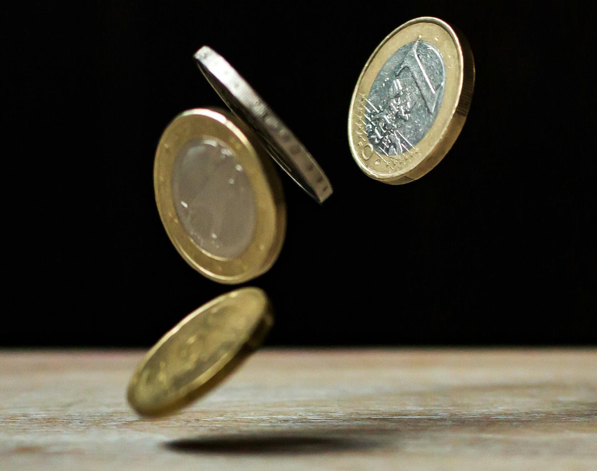 Coins on Brown Wood