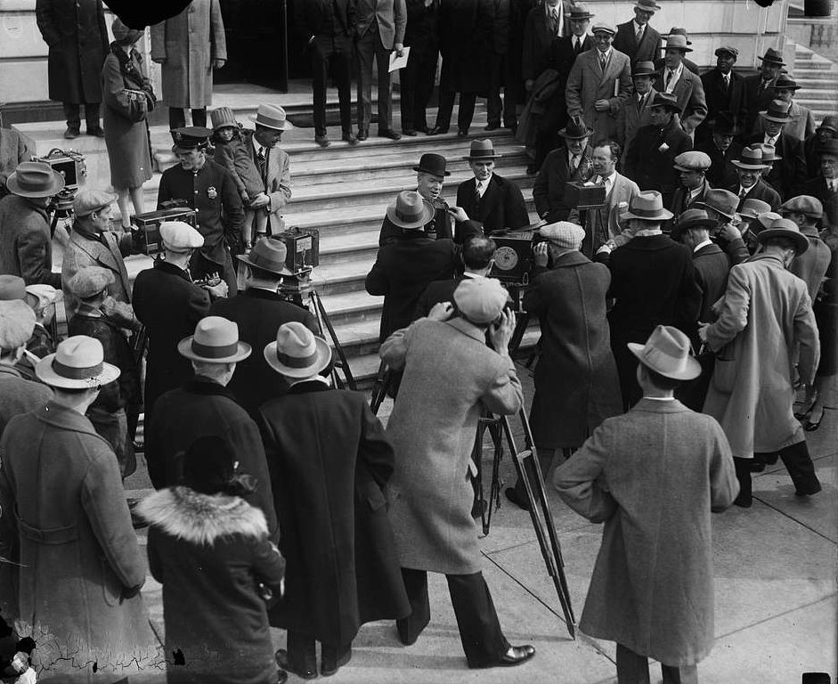 News press in front of U.S. Capitol.
