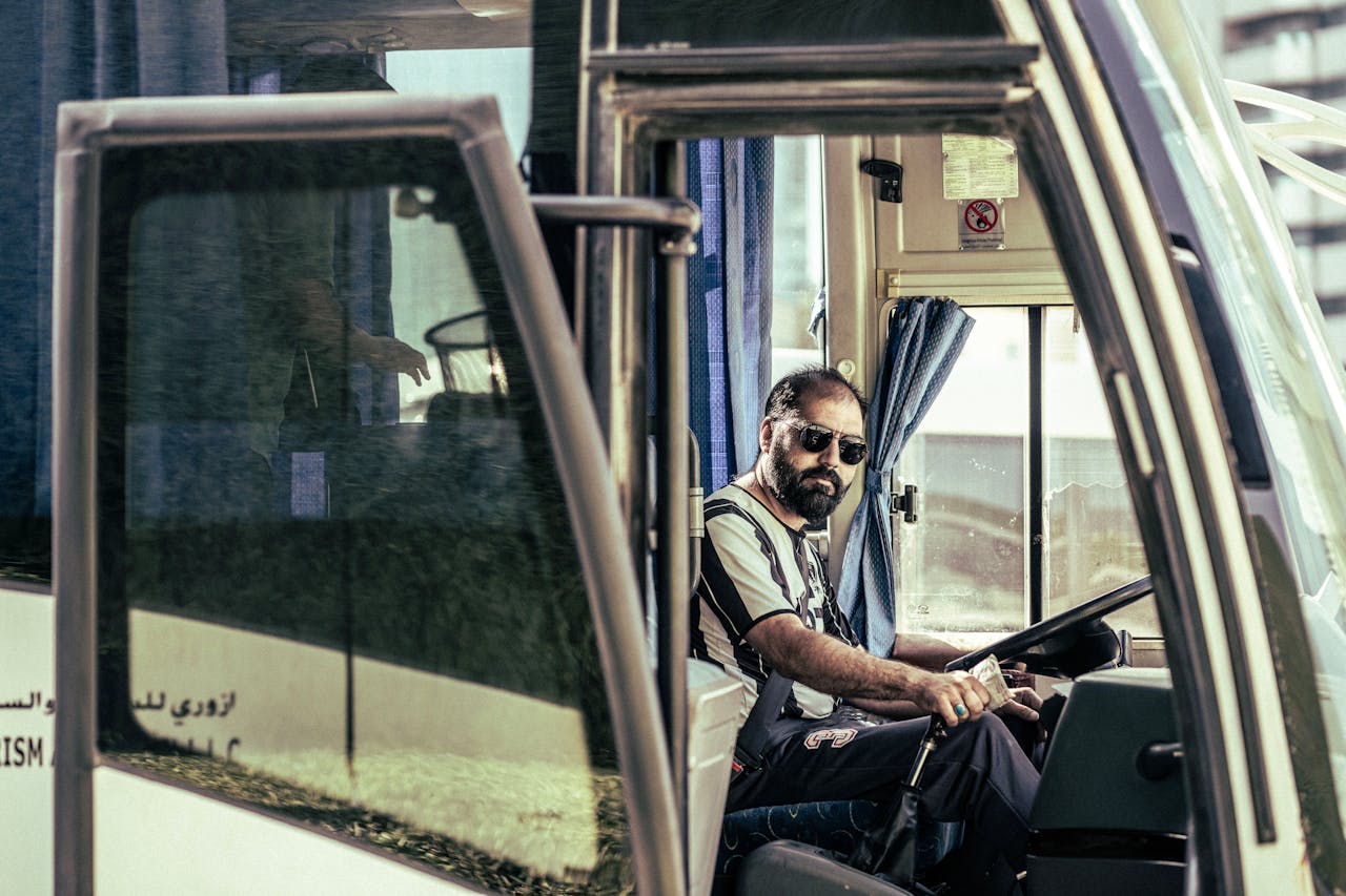 Bus driver inside a bus.