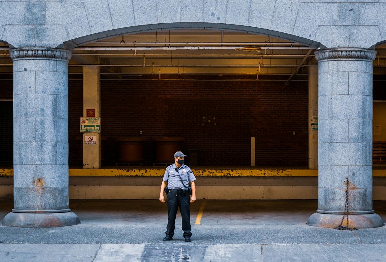 Security Guard Standing Near a Building.