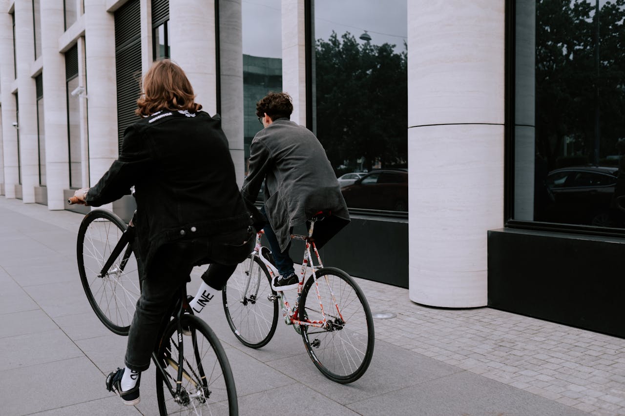 Two men riding bicycles