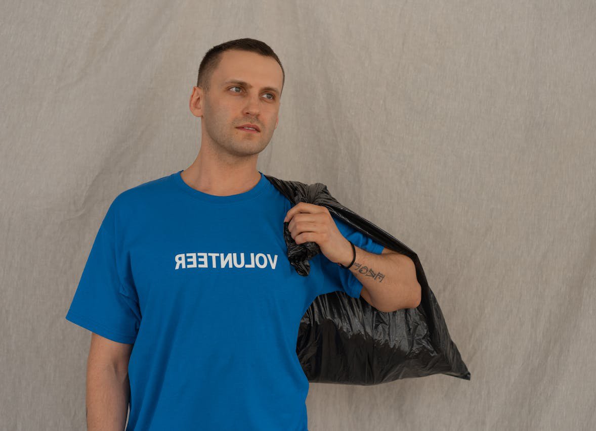 A male volunteer in a blue shirt