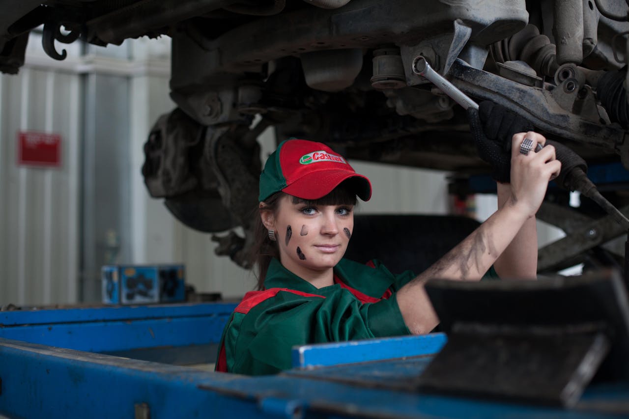 Woman working as Auto Mechanic.