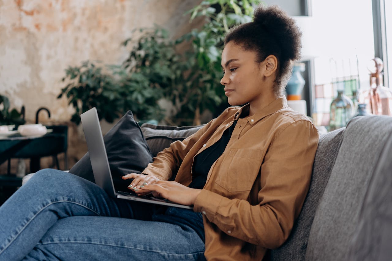 Woman working on laptop.