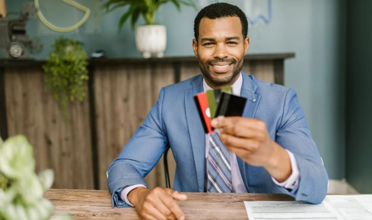 Person holding cards 