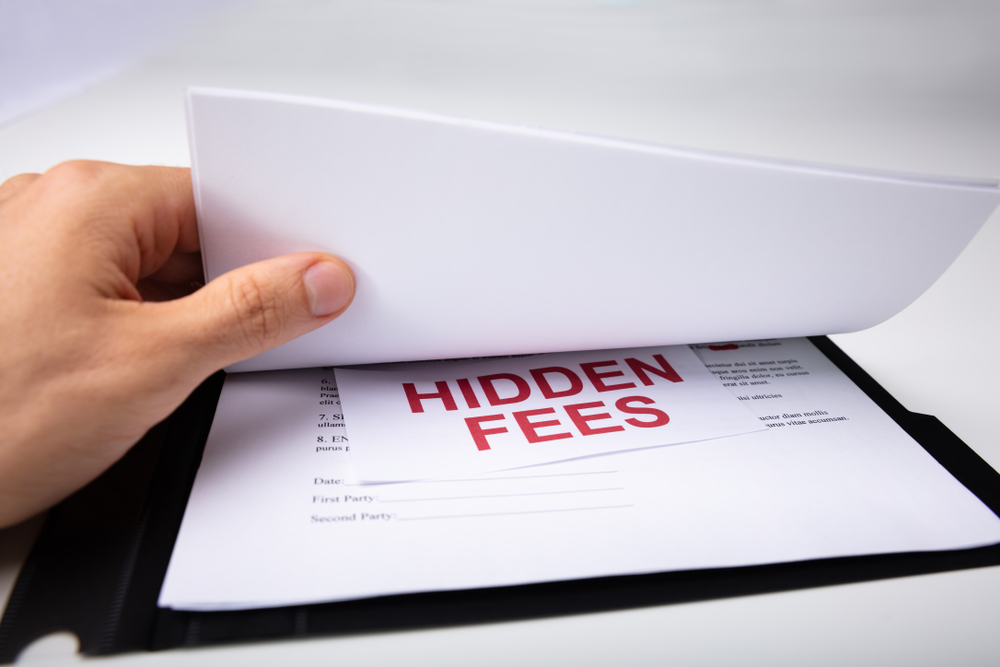 Person Finding Hidden Fees In His Contract