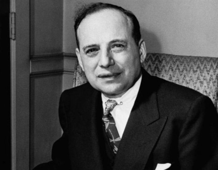 Benjamin Graham reading an edition of Moody's Manual